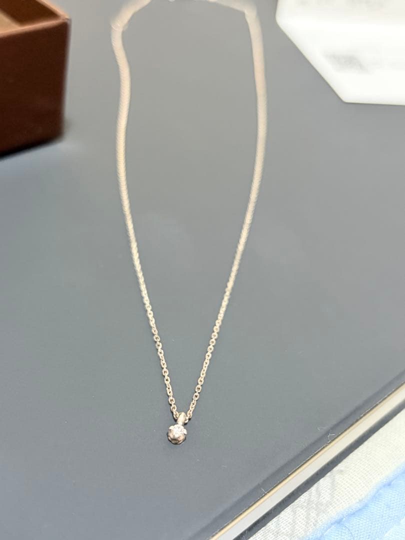 Agete silver necklace featuring sparkling diamonds with no visible damage or discoloration