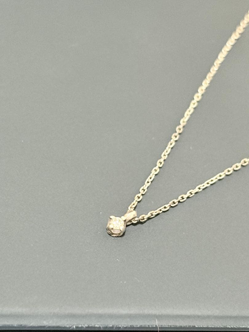 Agete silver necklace featuring sparkling diamonds with no visible damage or discoloration