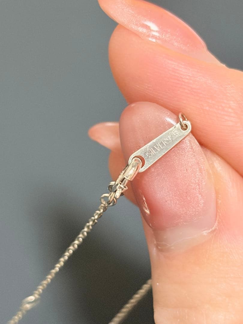 Agete silver necklace featuring sparkling diamonds with no visible damage or discoloration
