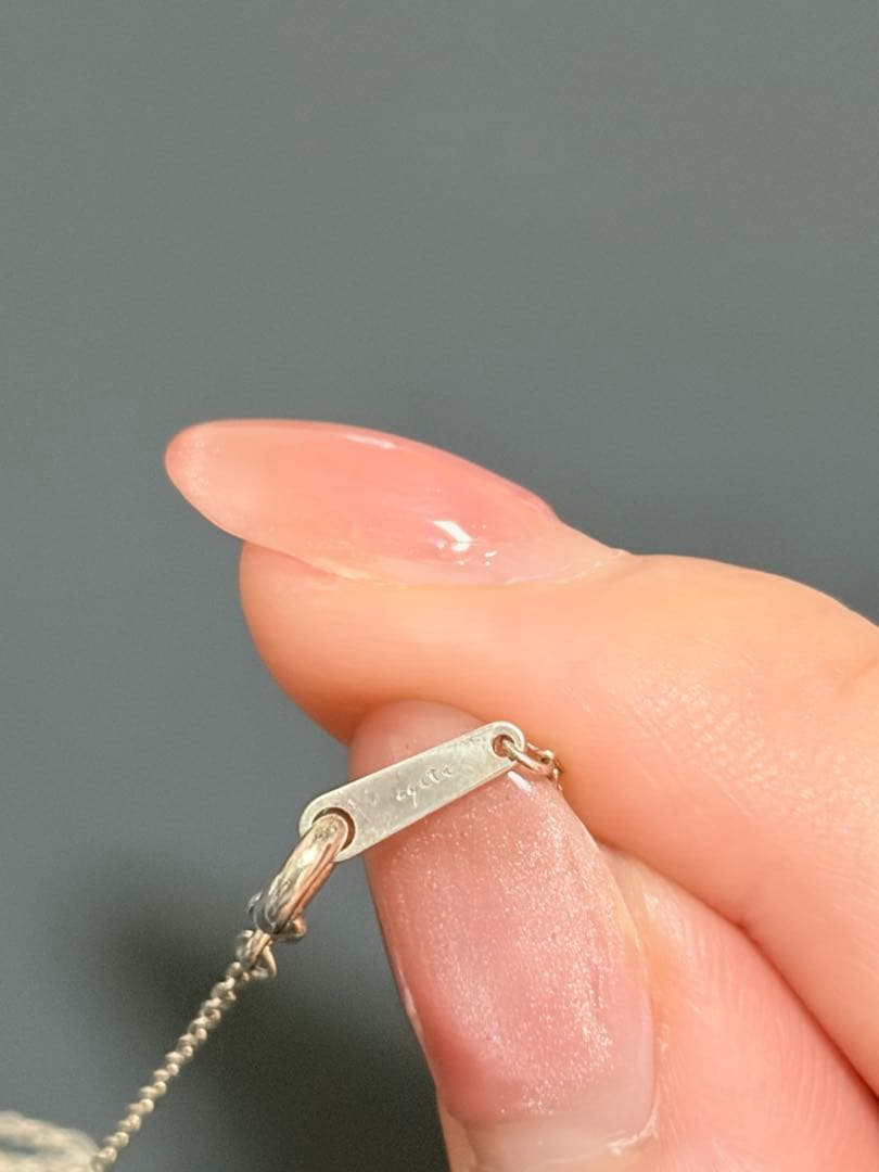 Agete silver necklace featuring sparkling diamonds with no visible damage or discoloration
