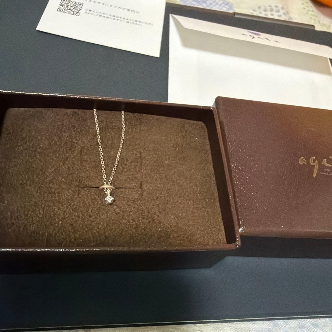 Agete silver necklace featuring sparkling diamonds with no visible damage or discoloration
