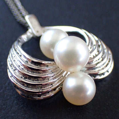 Mikimoto Akoya pearl silver necklace with three pearls and a 49 cm chain displayed on a white background