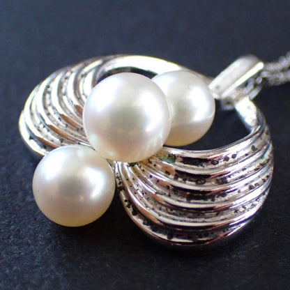 Mikimoto Akoya pearl silver necklace with three pearls and a 49 cm chain displayed on a white background