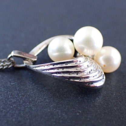 Mikimoto Akoya pearl silver necklace with three pearls and a 49 cm chain displayed on a white background