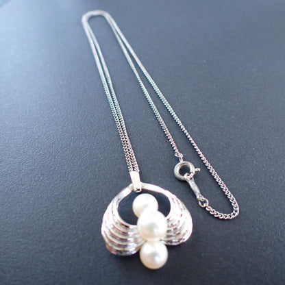 Mikimoto Akoya pearl silver necklace with three pearls and a 49 cm chain displayed on a white background