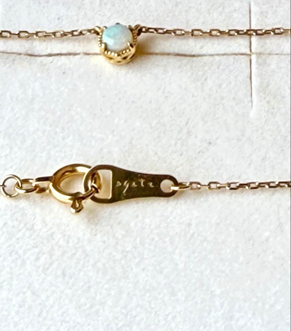 Agete K18 yellow gold necklace with 3.5mm opal stone and 45cm chain on white background
