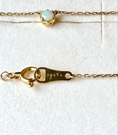 Agete K18 yellow gold necklace with 3.5mm opal stone and 45cm chain on white background