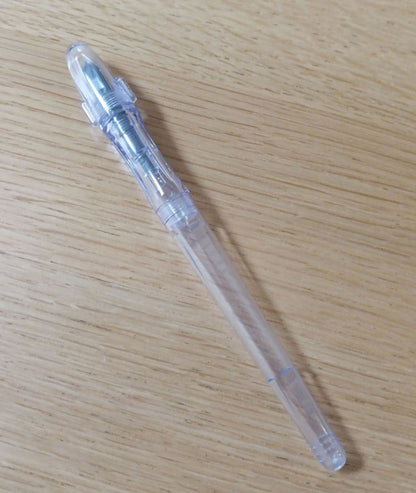 Pilot Penmanship clear fountain pen with extra fine nib, includes case and ink, new and unused