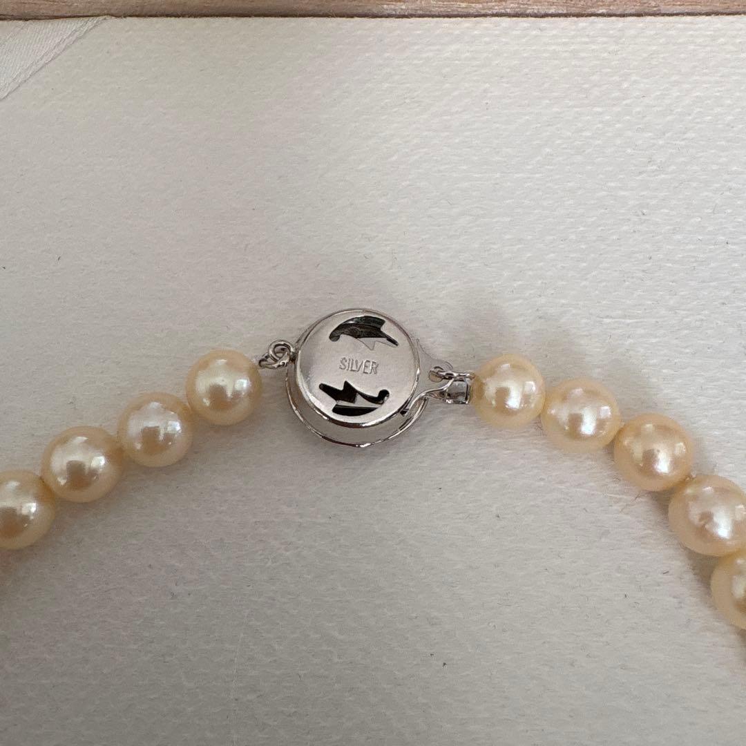 Single strand Akoya genuine pearl necklace with 7mm cream tone pearls and silver clasp