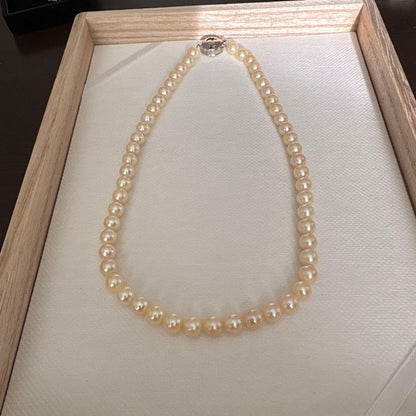 Single strand Akoya genuine pearl necklace with 7mm cream tone pearls and silver clasp
