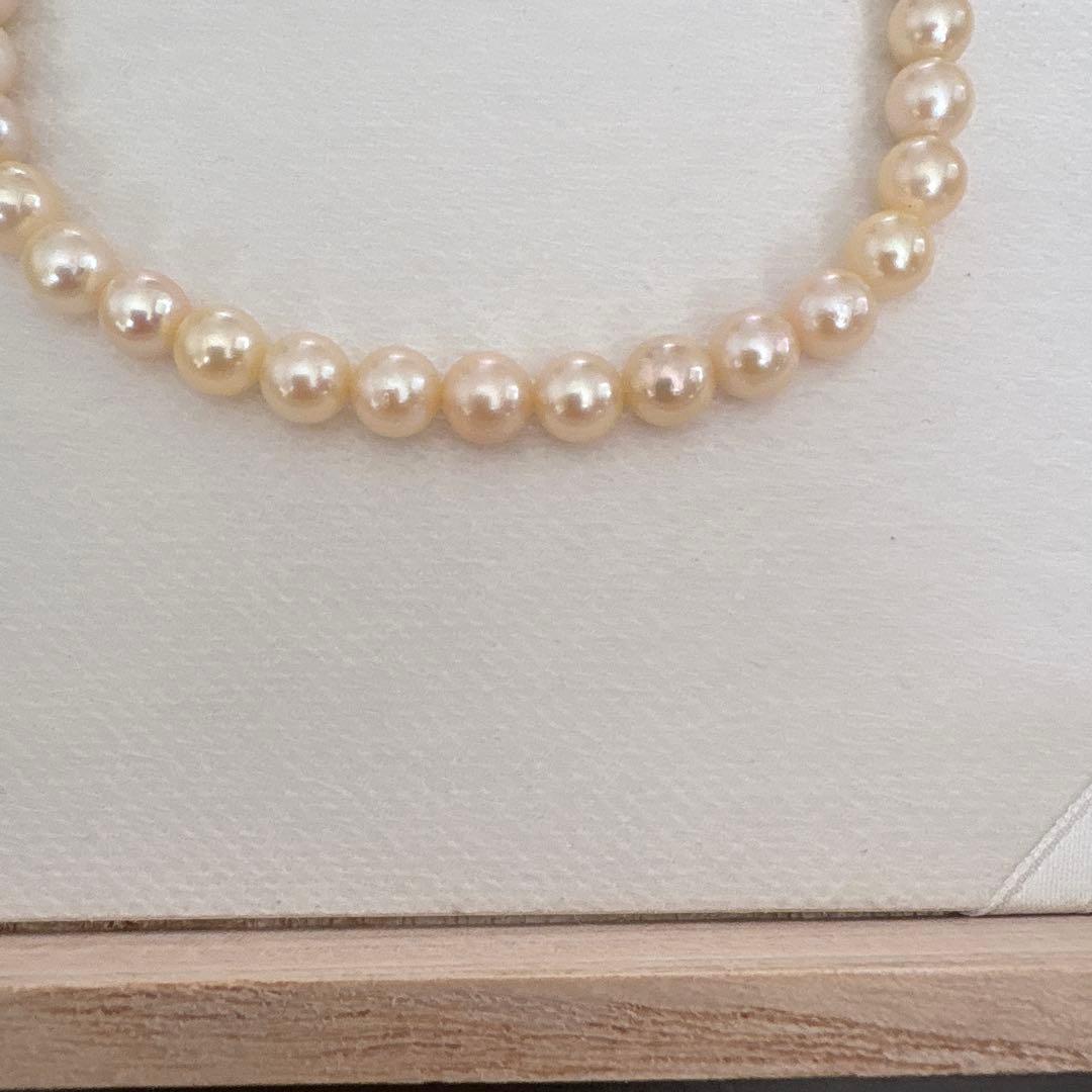 Single strand Akoya genuine pearl necklace with 7mm cream tone pearls and silver clasp