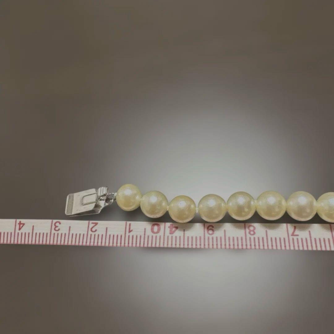 Single strand Akoya genuine pearl necklace with 7mm cream tone pearls and silver clasp