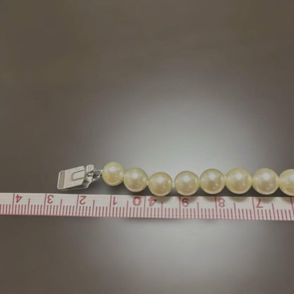 Single strand Akoya genuine pearl necklace with 7mm cream tone pearls and silver clasp