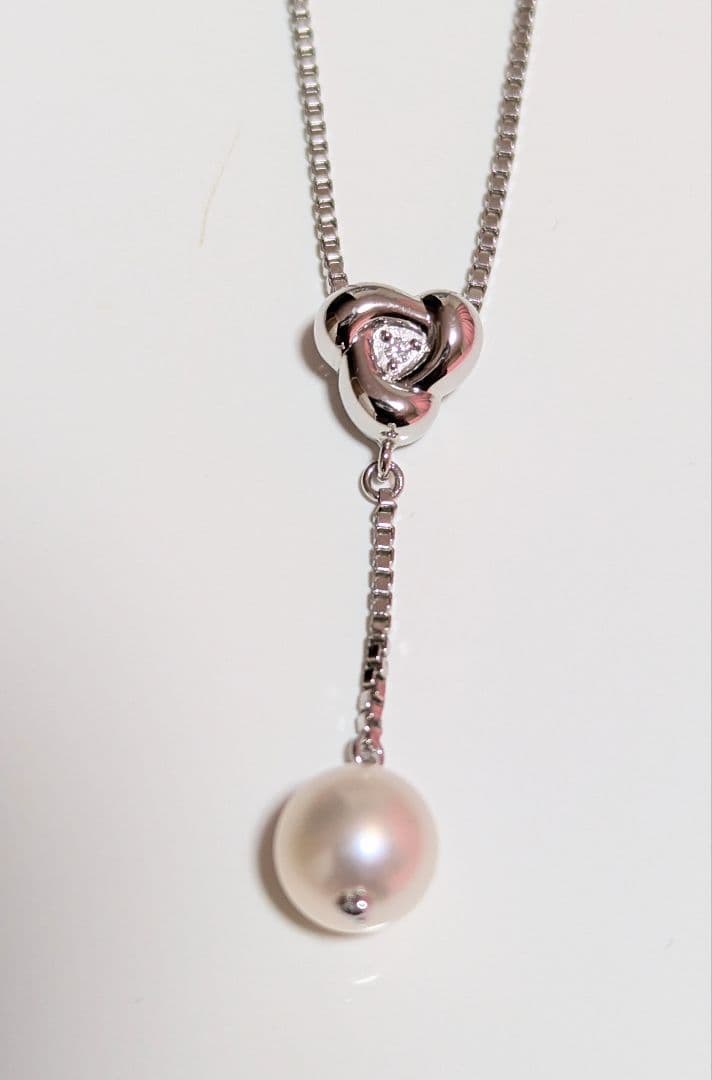 Tasaki pearl necklace with sterling silver chain and 0.01 carat diamond pendant, medium pearl, lobster clasp