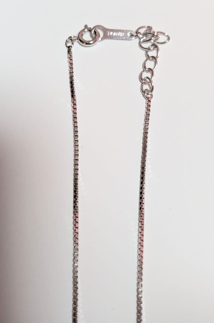 Tasaki pearl necklace with sterling silver chain and 0.01 carat diamond pendant, medium pearl, lobster clasp