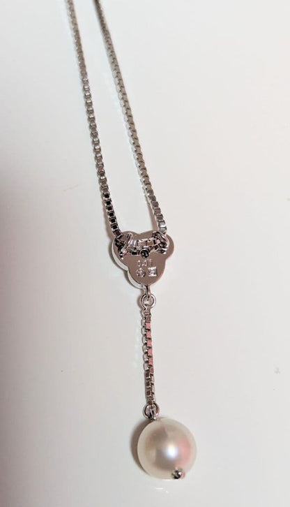 Tasaki pearl necklace with sterling silver chain and 0.01 carat diamond pendant, medium pearl, lobster clasp