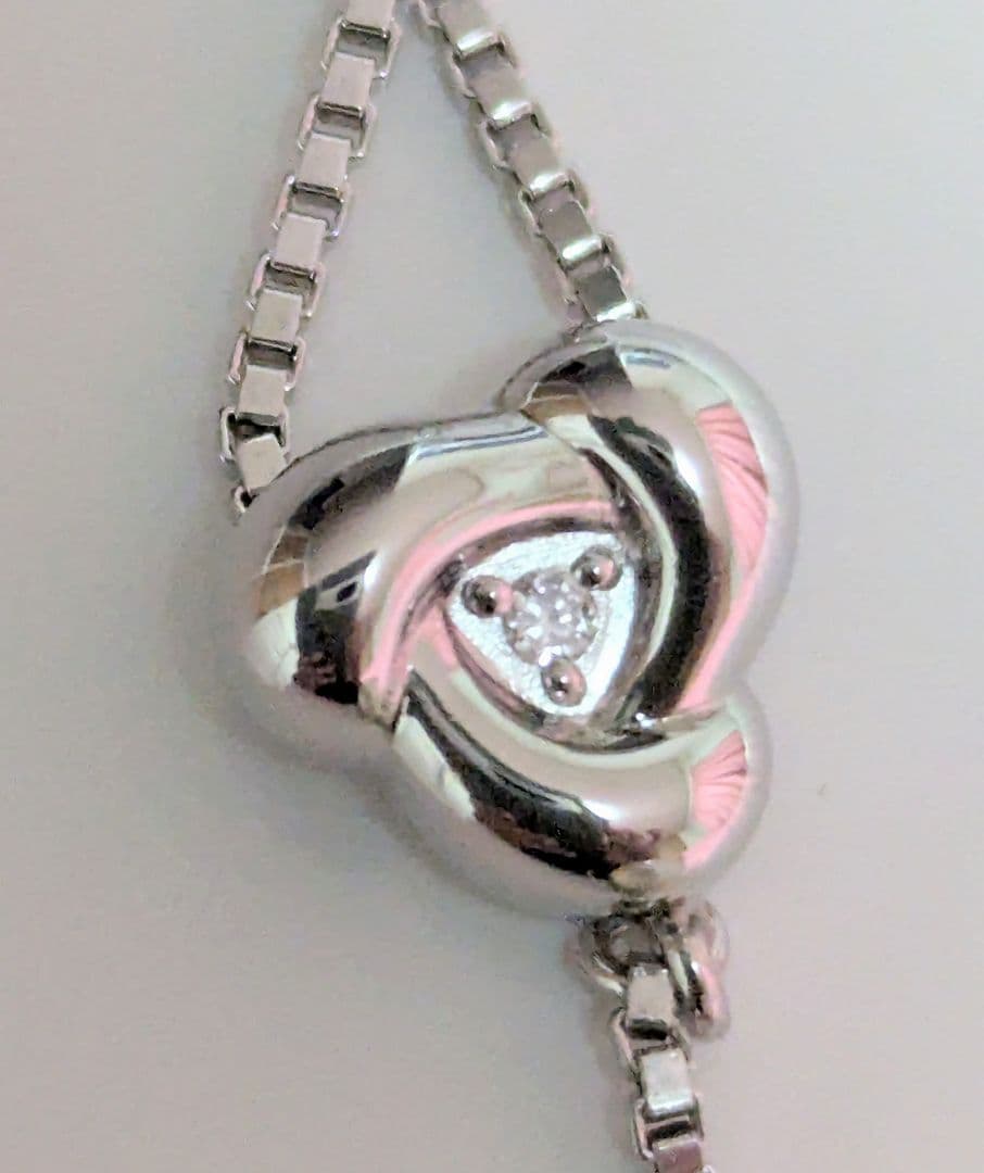 Tasaki pearl necklace with sterling silver chain and 0.01 carat diamond pendant, medium pearl, lobster clasp