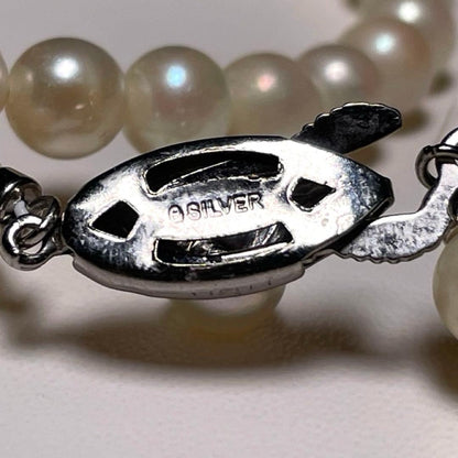 Close-up of Ise-Shima white Akoya pearl necklace with 5.4-5.9mm round pearls and silver clasp