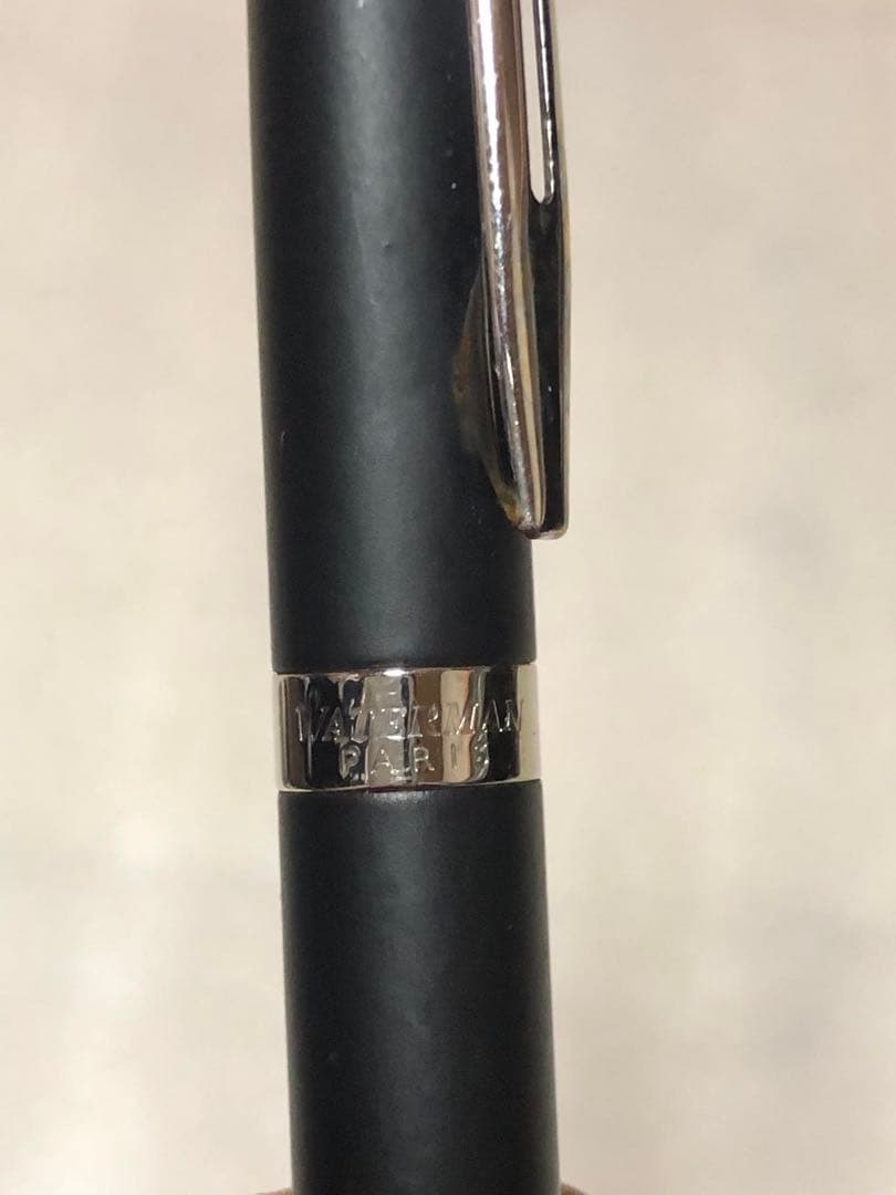 Sleek Waterman ballpoint pen with black barrel and silver clip on a white background