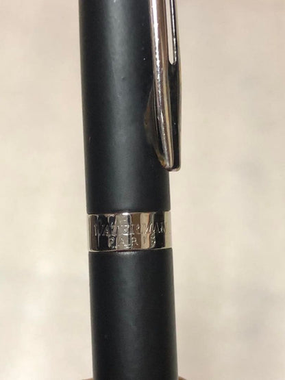 Sleek Waterman ballpoint pen with black barrel and silver clip on a white background