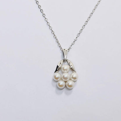 Mikimoto baby pearl necklace with 3.9mm pearl and silver flower pendant on 40cm chain