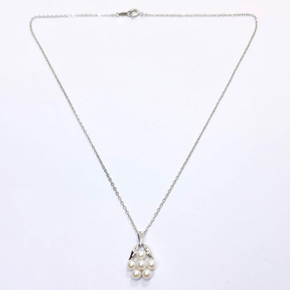 Mikimoto baby pearl necklace with 3.9mm pearl and silver flower pendant on 40cm chain
