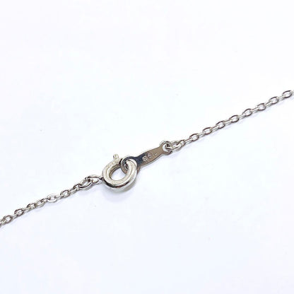 Mikimoto baby pearl necklace with 3.9mm pearl and silver flower pendant on 40cm chain