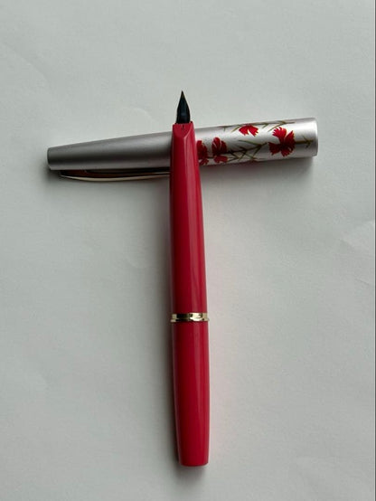 Close-up of PILOT Fountain Pen Model 14K-585 with gold nib and black barrel