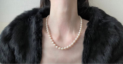 Untreated genuine 7mm pearl necklace in silver with 44cm length shown on white background