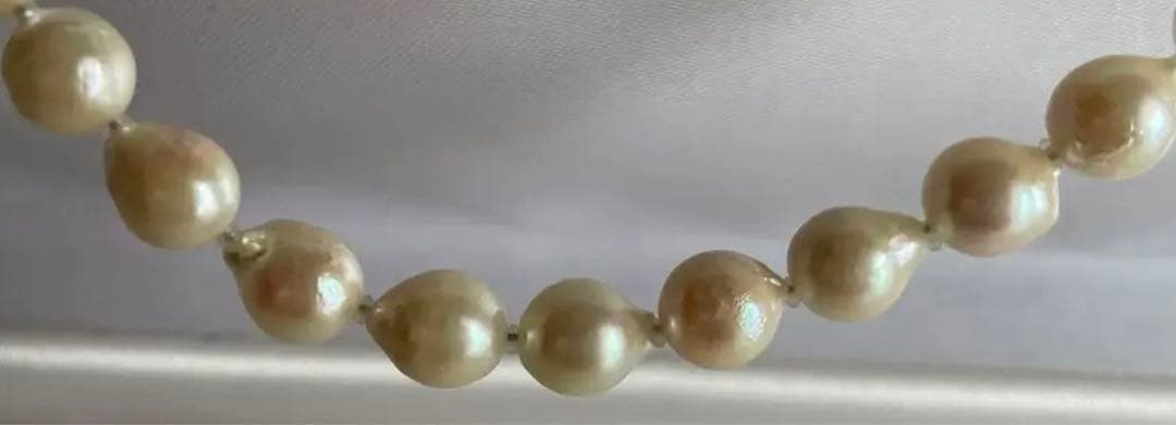 Untreated genuine 7mm pearl necklace in silver with 44cm length shown on white background