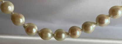 Untreated genuine 7mm pearl necklace in silver with 44cm length shown on white background