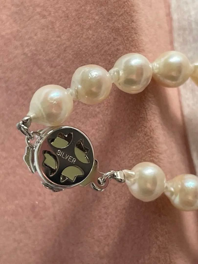 Untreated genuine 7mm pearl necklace in silver with 44cm length shown on white background