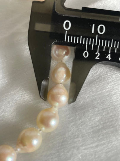 Untreated genuine 7mm pearl necklace in silver with 44cm length shown on white background
