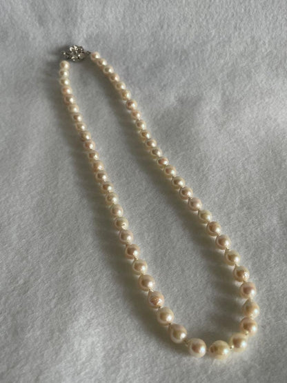 Untreated genuine 7mm pearl necklace in silver with 44cm length shown on white background