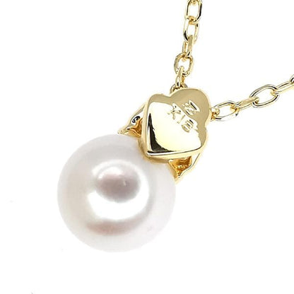 Law ring in K18 yellow gold featuring a 6.7mm pearl and diamond side stones, size height 11.3mm