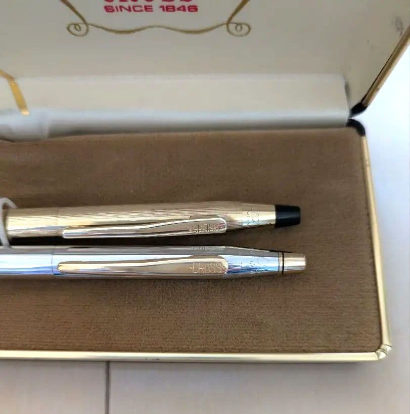 CROSS set of gold mechanical pencil and silver ballpoint pen displayed with black case and instruction manual