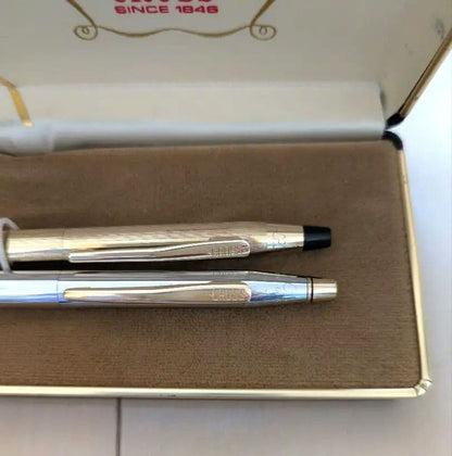 CROSS set of gold mechanical pencil and silver ballpoint pen displayed with black case and instruction manual