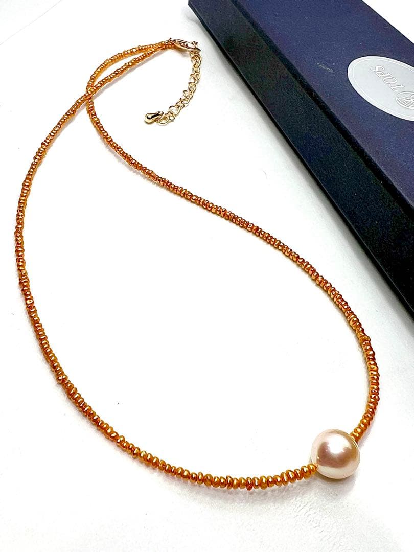 Gold Akoya pearl necklace featuring 8.5mm gold pearls and 2mm gold Kesh baby pearls on adjustable chain