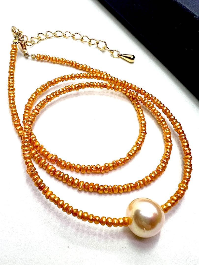 Gold Akoya pearl necklace featuring 8.5mm gold pearls and 2mm gold Kesh baby pearls on adjustable chain
