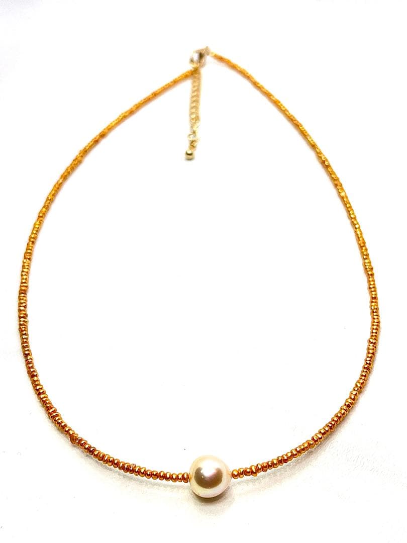 Gold Akoya pearl necklace featuring 8.5mm gold pearls and 2mm gold Kesh baby pearls on adjustable chain