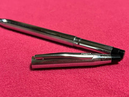 Cross Chrome Century ballpoint pen with old logo, metal body, showing used condition and minor scratches