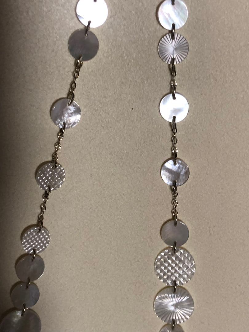 Agete white shell long necklace with silver and gold plated chain shown at 90cm length