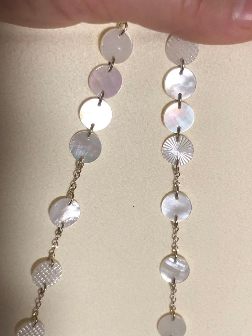 Agete white shell long necklace with silver and gold plated chain shown at 90cm length