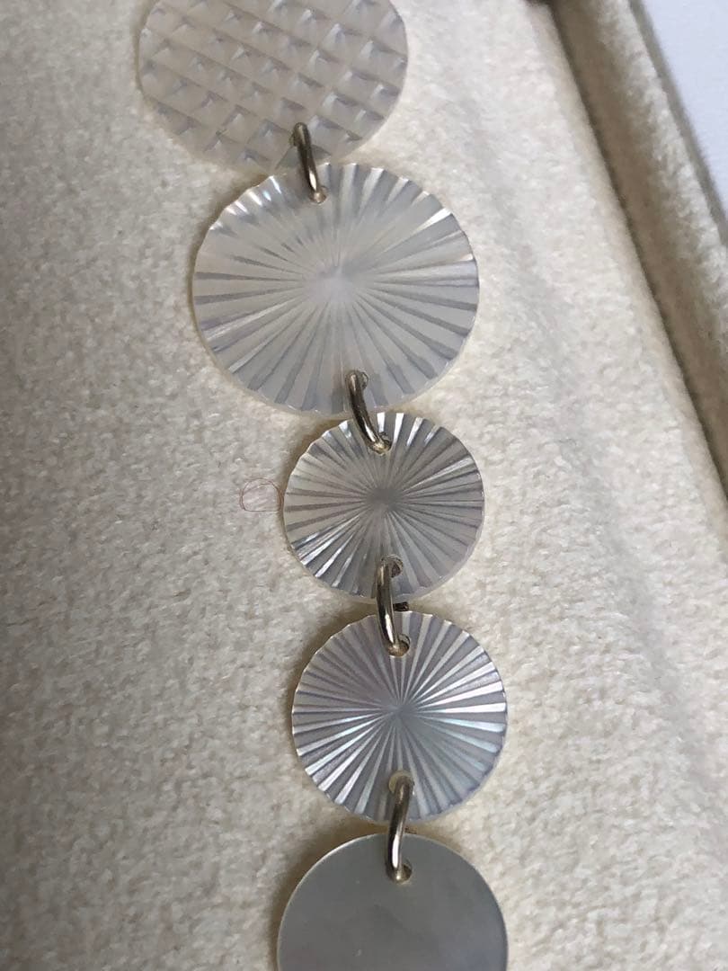 Agete white shell long necklace with silver and gold plated chain shown at 90cm length
