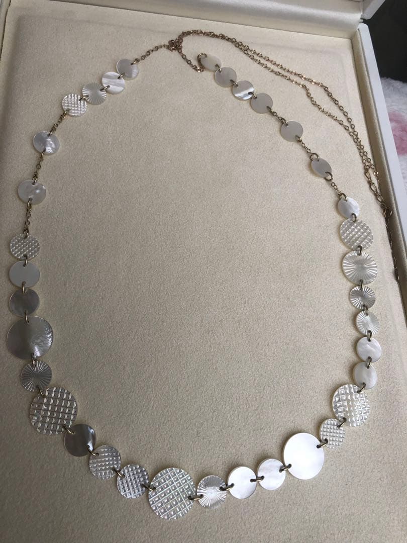 Agete white shell long necklace with silver and gold plated chain shown at 90cm length