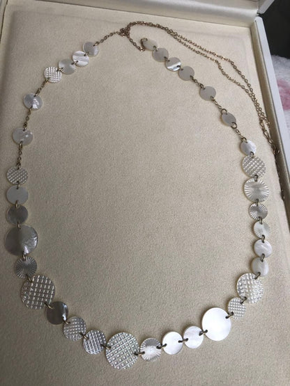 Agete white shell long necklace with silver and gold plated chain shown at 90cm length
