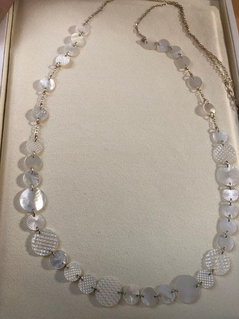 Agete white shell long necklace with silver and gold plated chain shown at 90cm length
