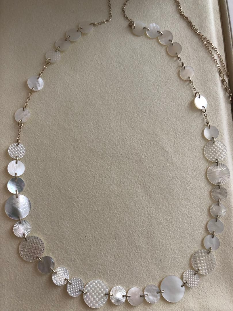 Agete white shell long necklace with silver and gold plated chain shown at 90cm length