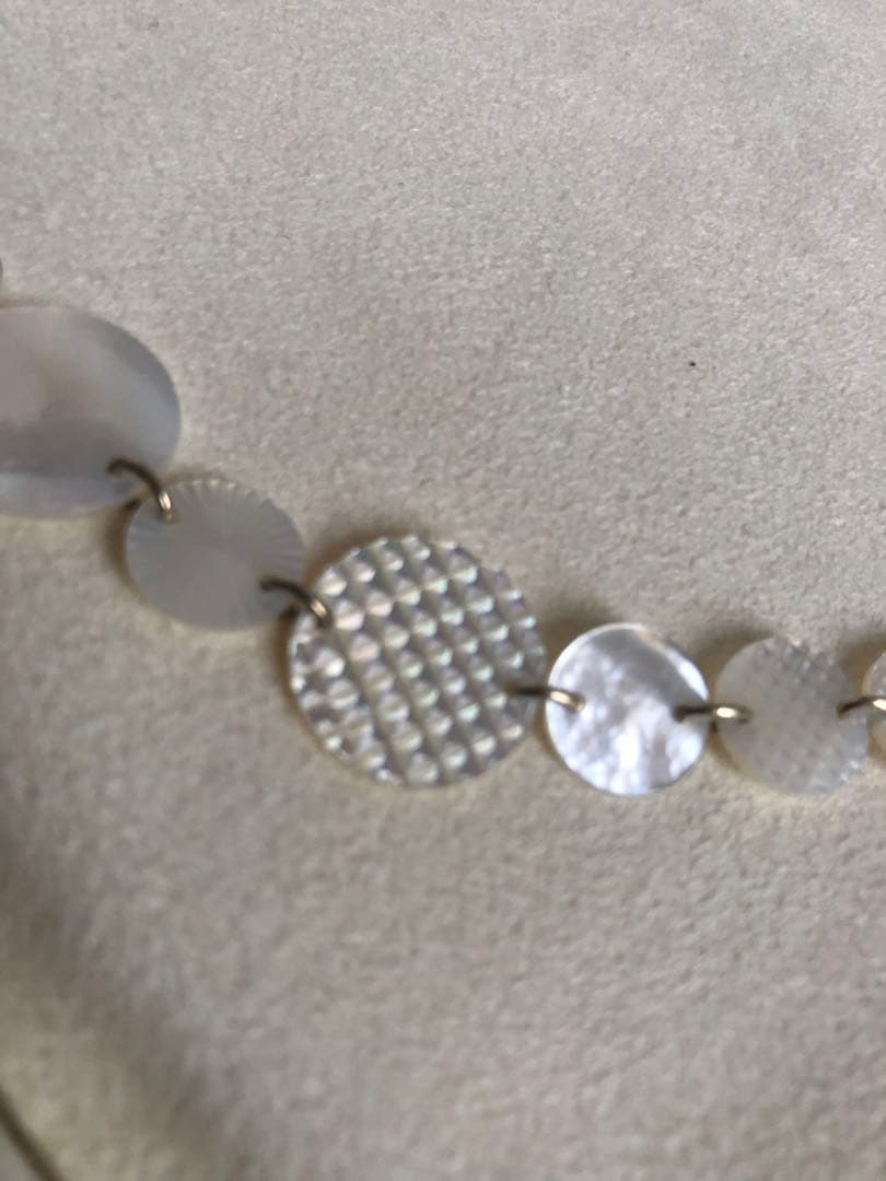 Agete white shell long necklace with silver and gold plated chain shown at 90cm length