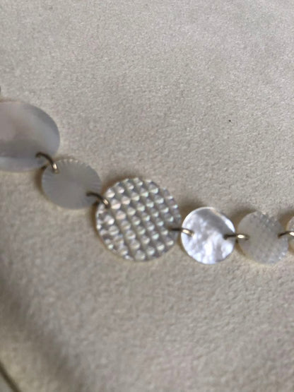 Agete white shell long necklace with silver and gold plated chain shown at 90cm length
